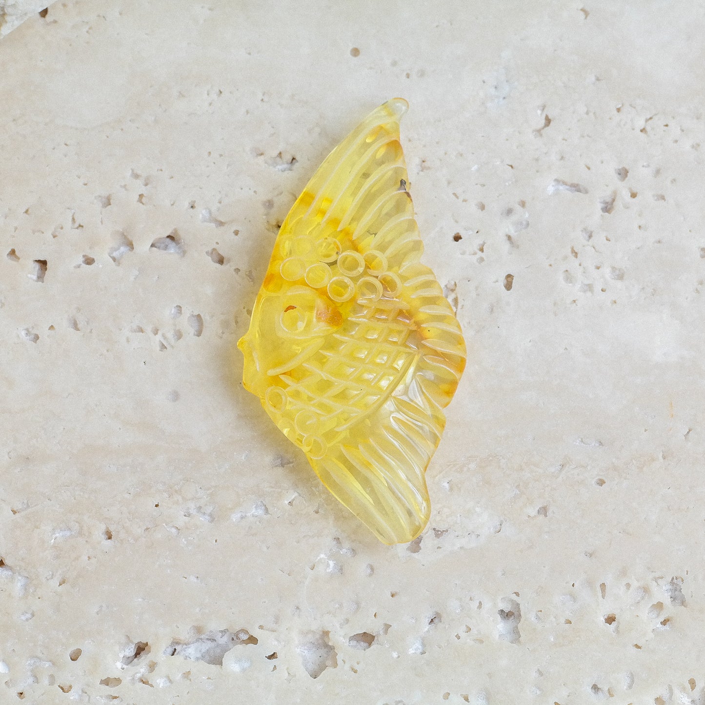 Hand carved fish figurine from natural Baltic amber