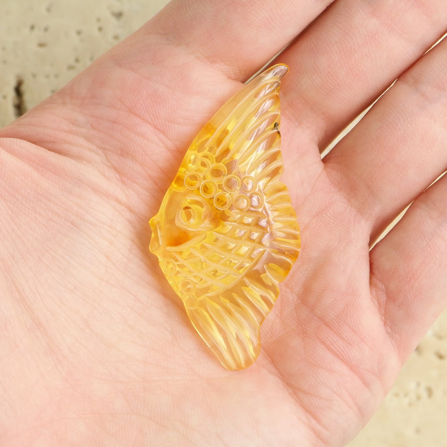 Hand carved fish figurine from natural Baltic amber