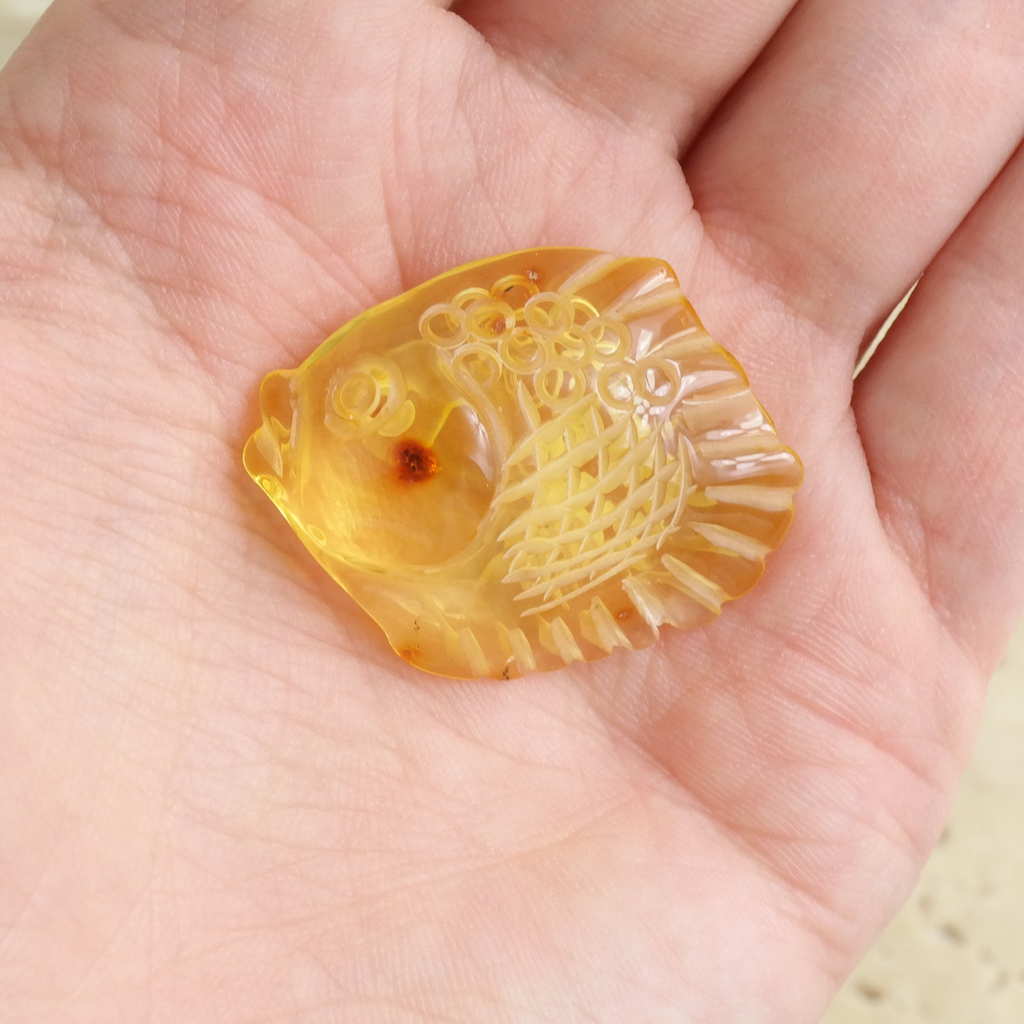 Hand carved fish figurine from natural Baltic amber