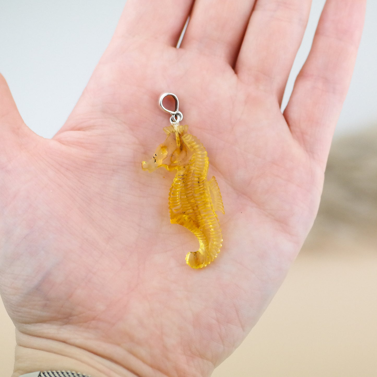 Hand carved seahorse pendant