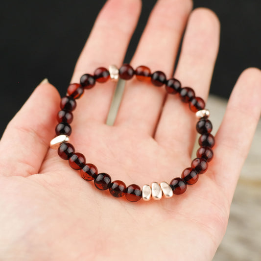 Chic natural amber bracelet with rose gold colour spacers