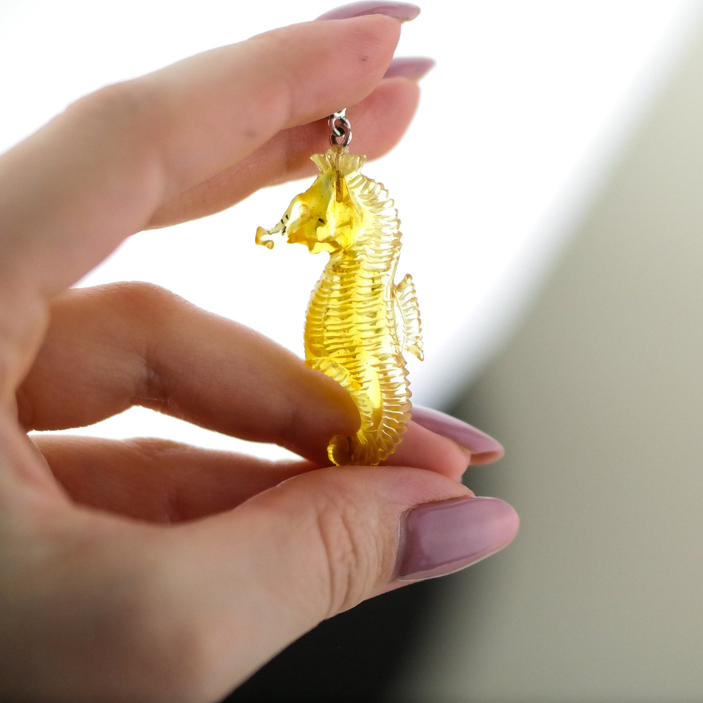 Hand carved seahorse pendant