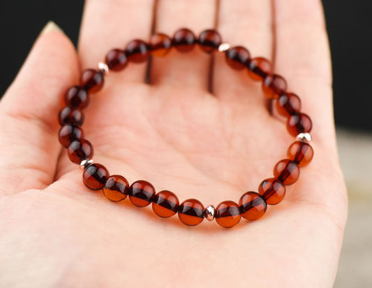 Chic natural Baltic amber bracelet with rose gold colour details