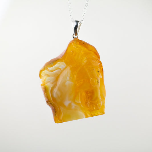 Horse head pendant from natural Baltic amber