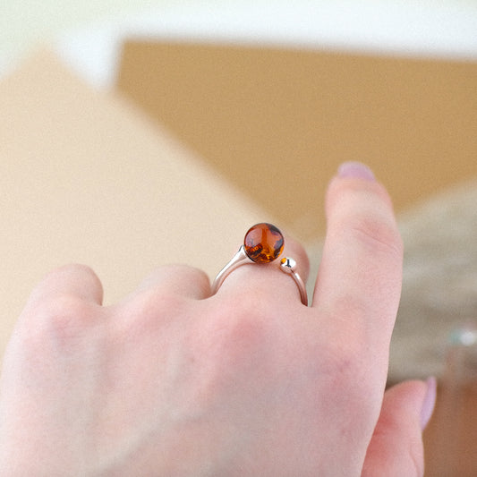 Silver ring with natural amber bead