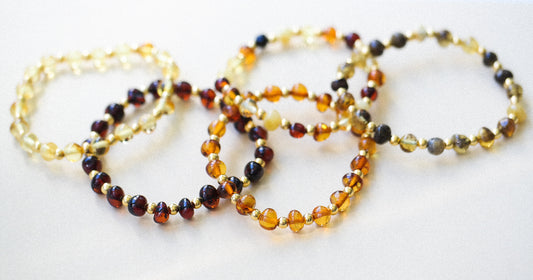 Chic amber bracelets with gold colour spacers