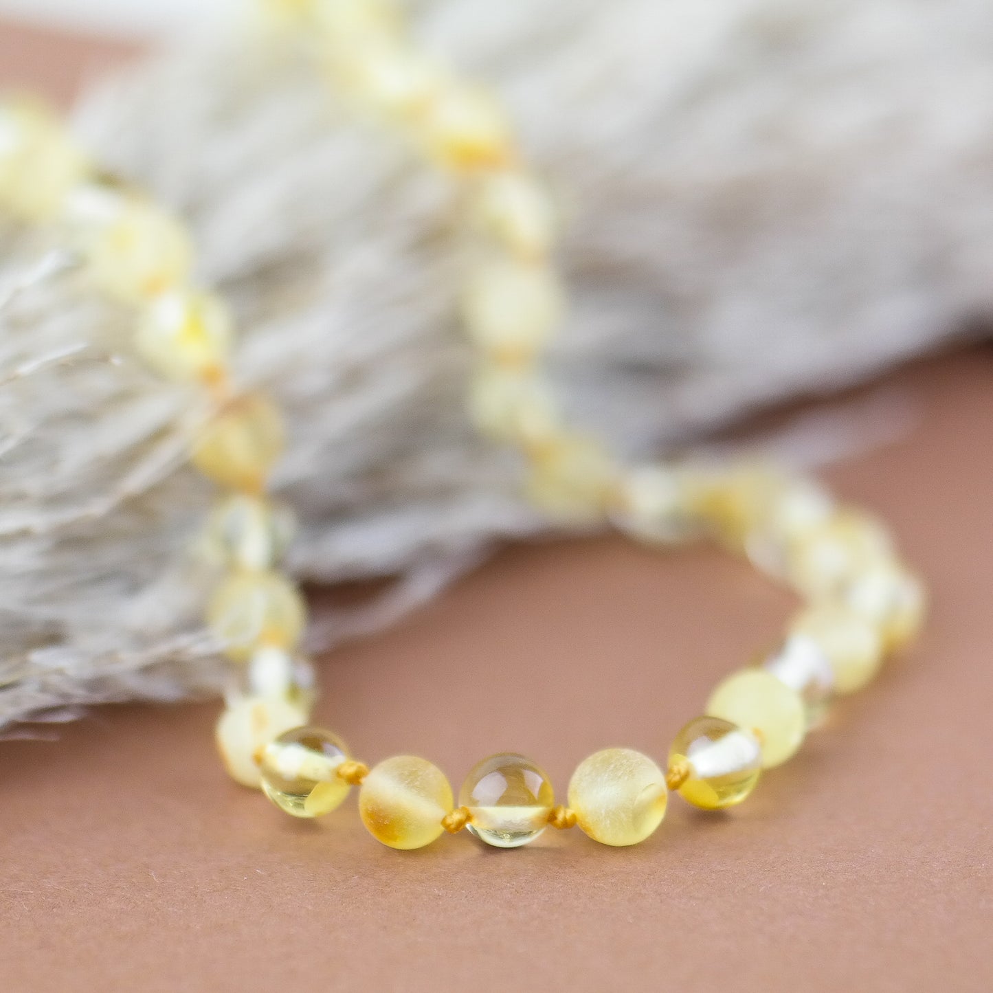 Necklace for kids from polished and raw amber beads