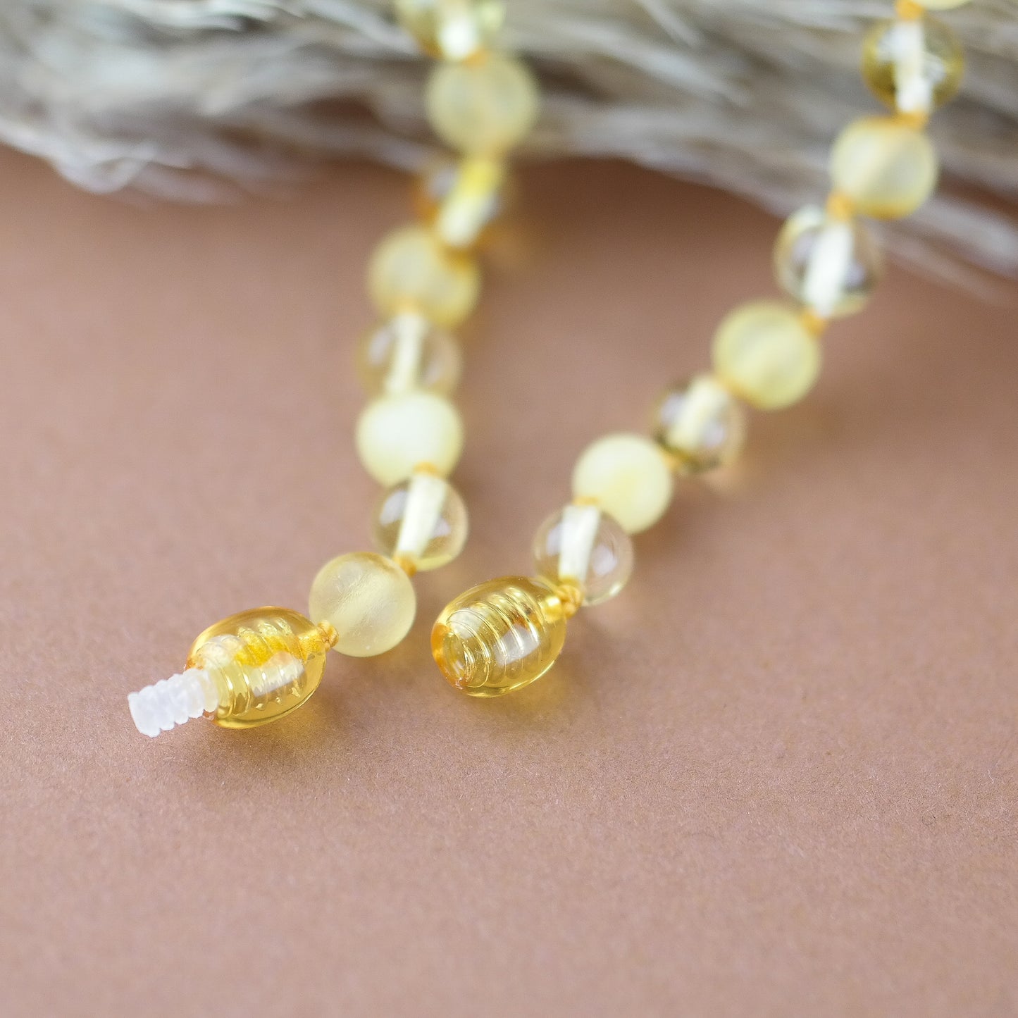 Necklace for kids from polished and raw amber beads