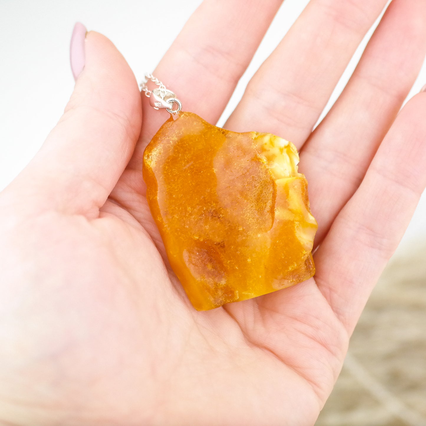 Horse head pendant from natural Baltic amber