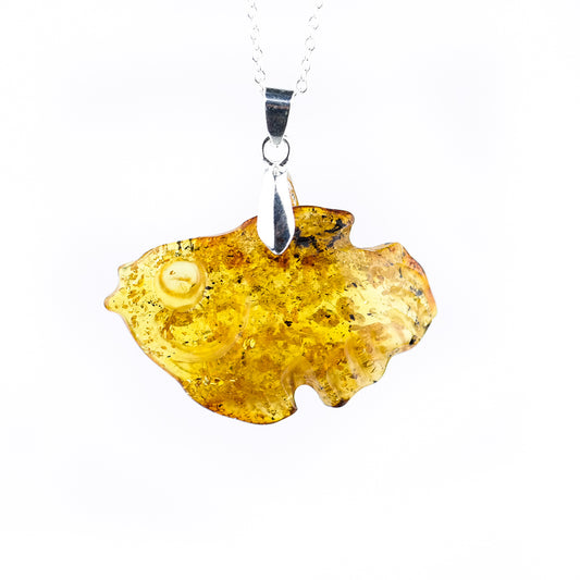 Amber pendant hand carved into a fish