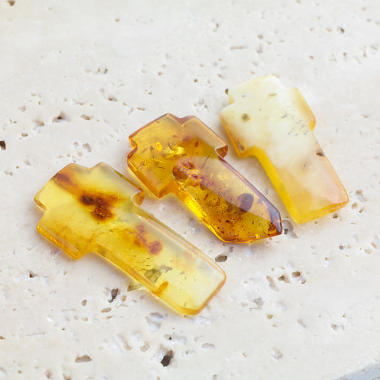 Beautiful hand carved crosses from natural Baltic amber