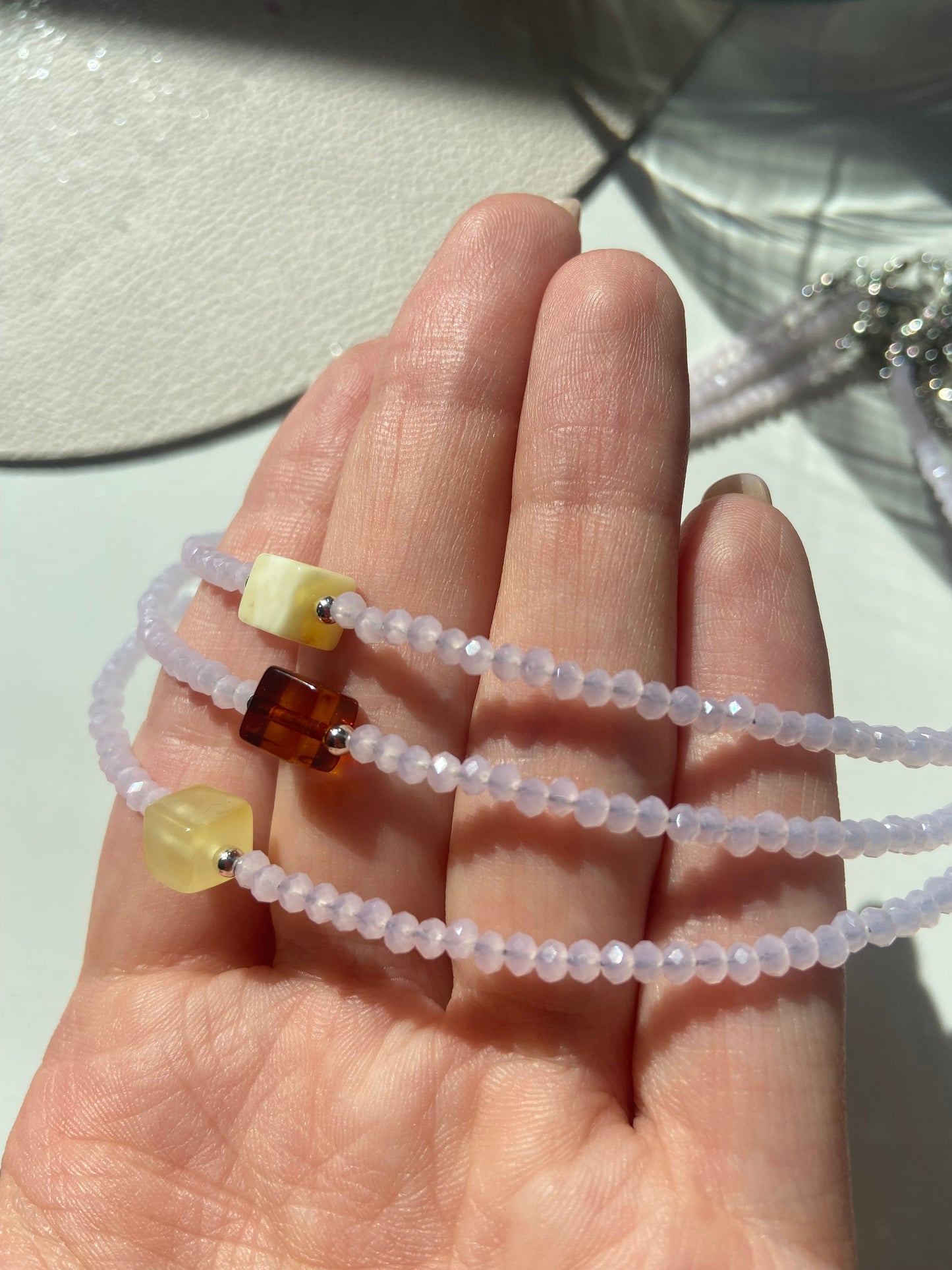 Pink stone choker with natural Baltic amber bead