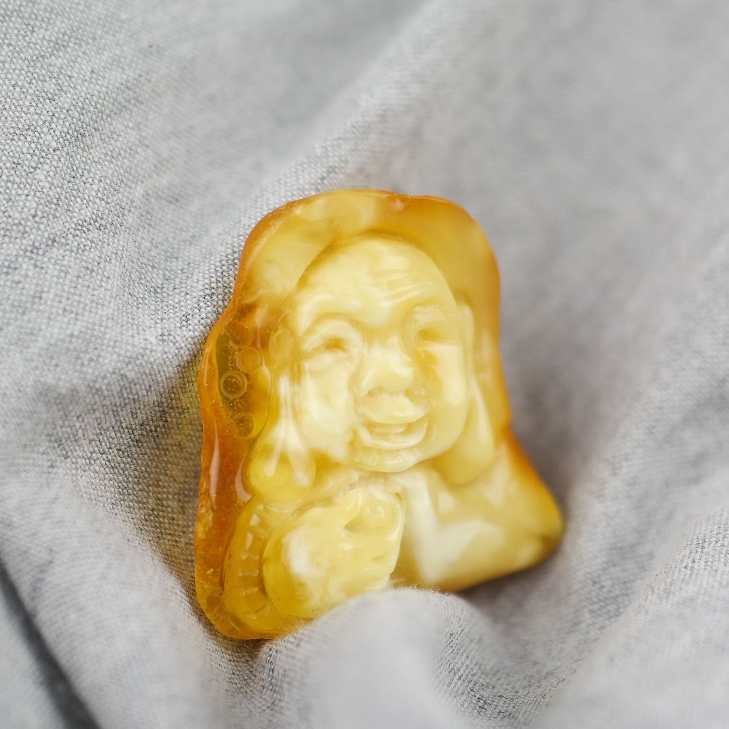 Hand carved amber buddha