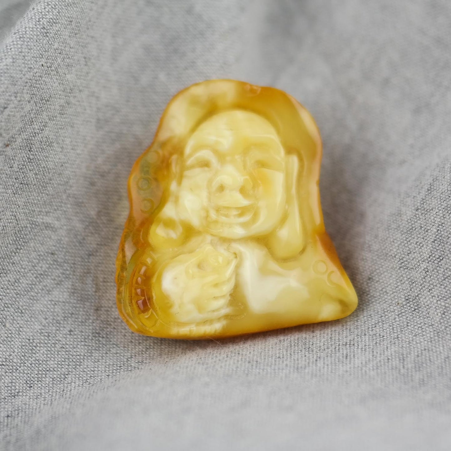 Hand carved amber buddha