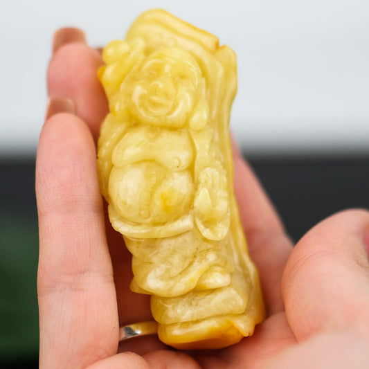 Hand carved amber buddha