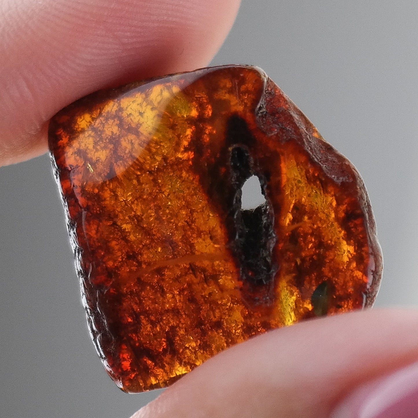 Lucky amber piece with natural hole