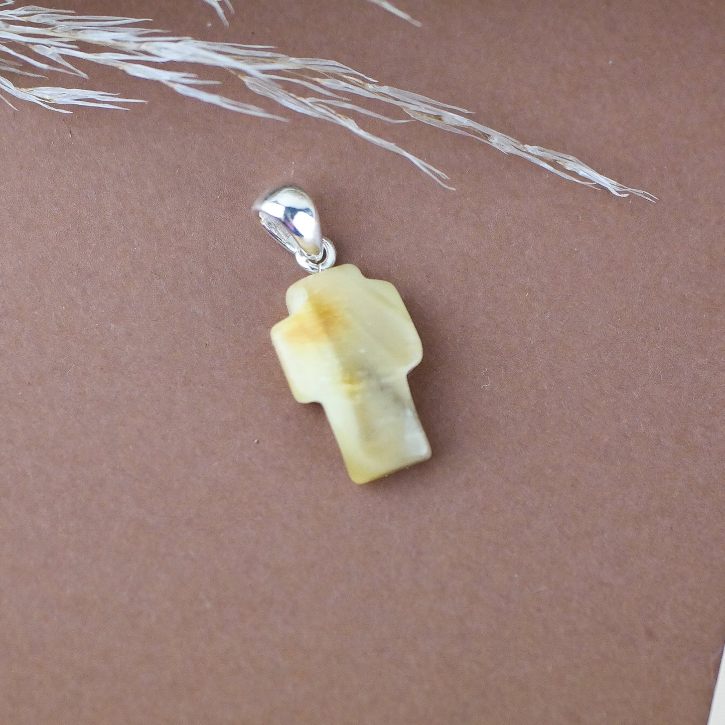 Amber cross pendant