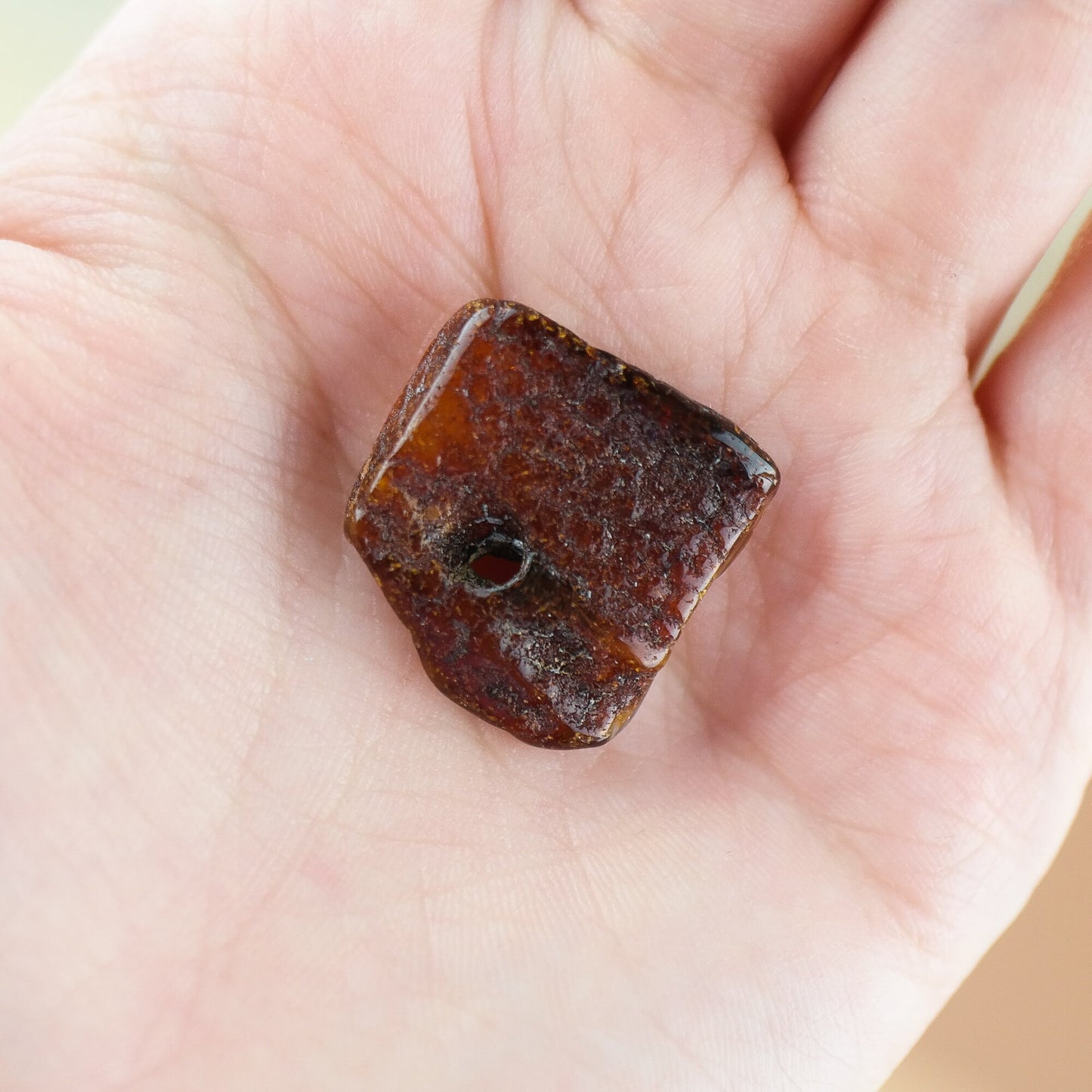 Lucky amber piece with natural hole