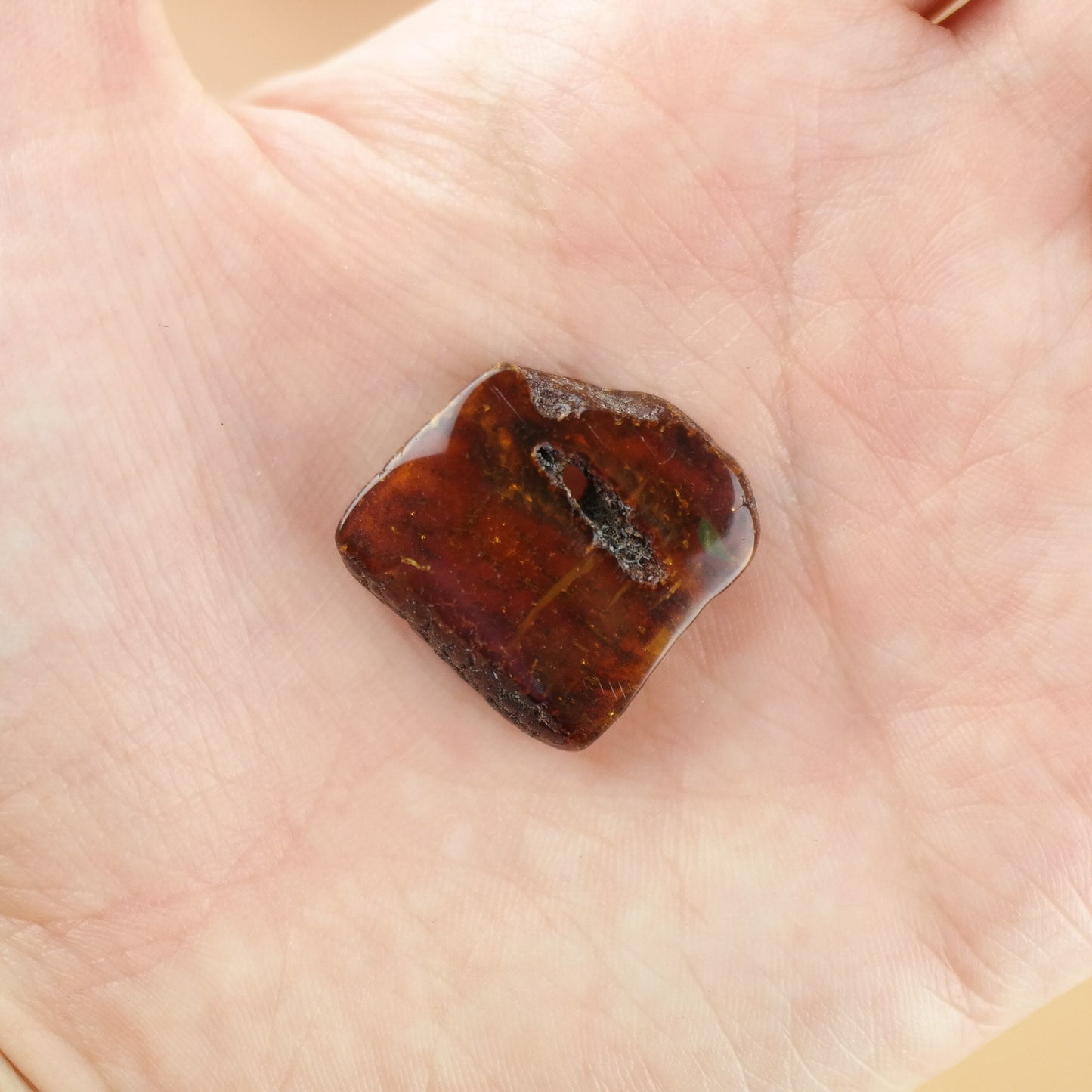 Lucky amber piece with natural hole