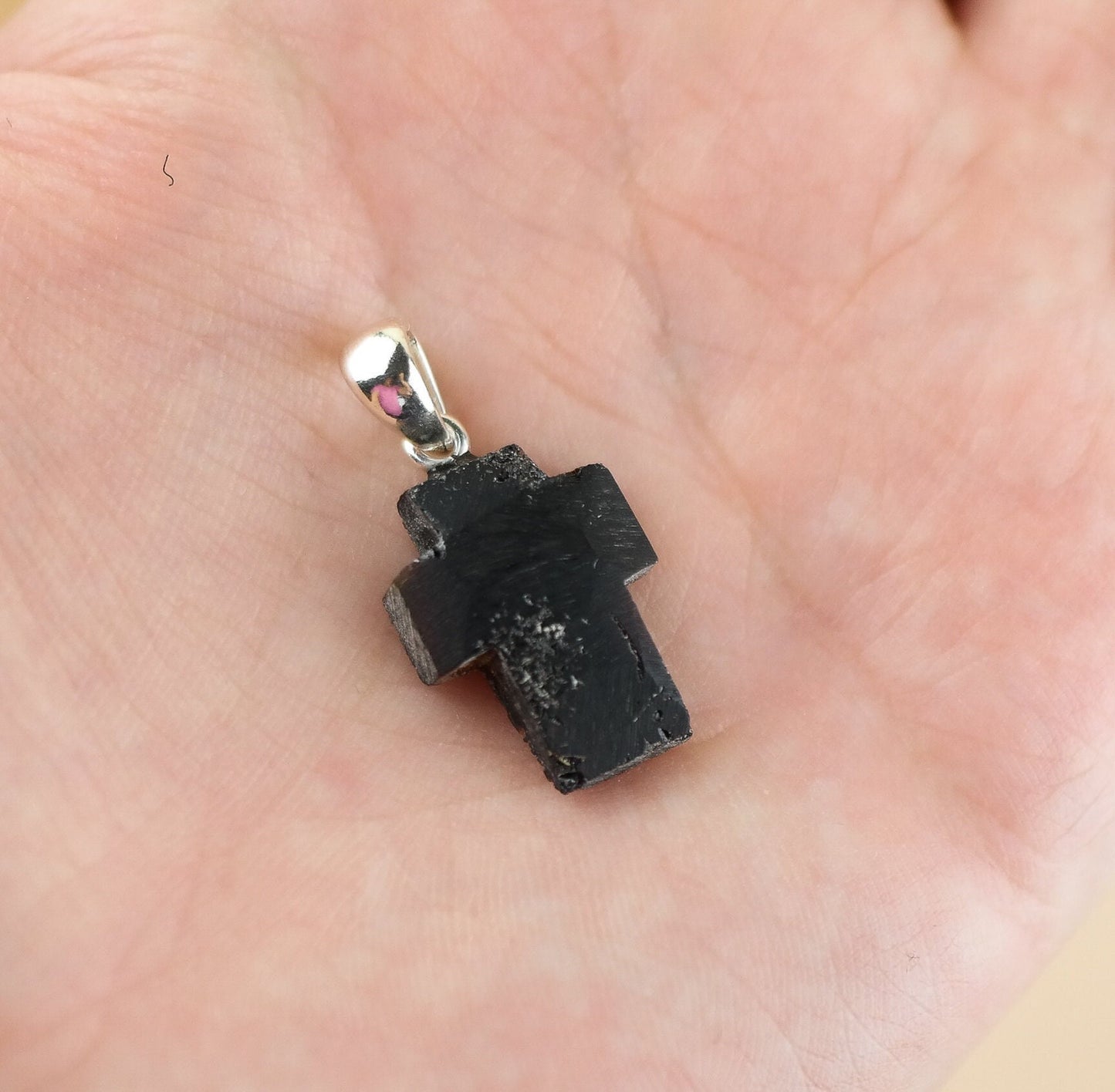 Black amber cross pendant