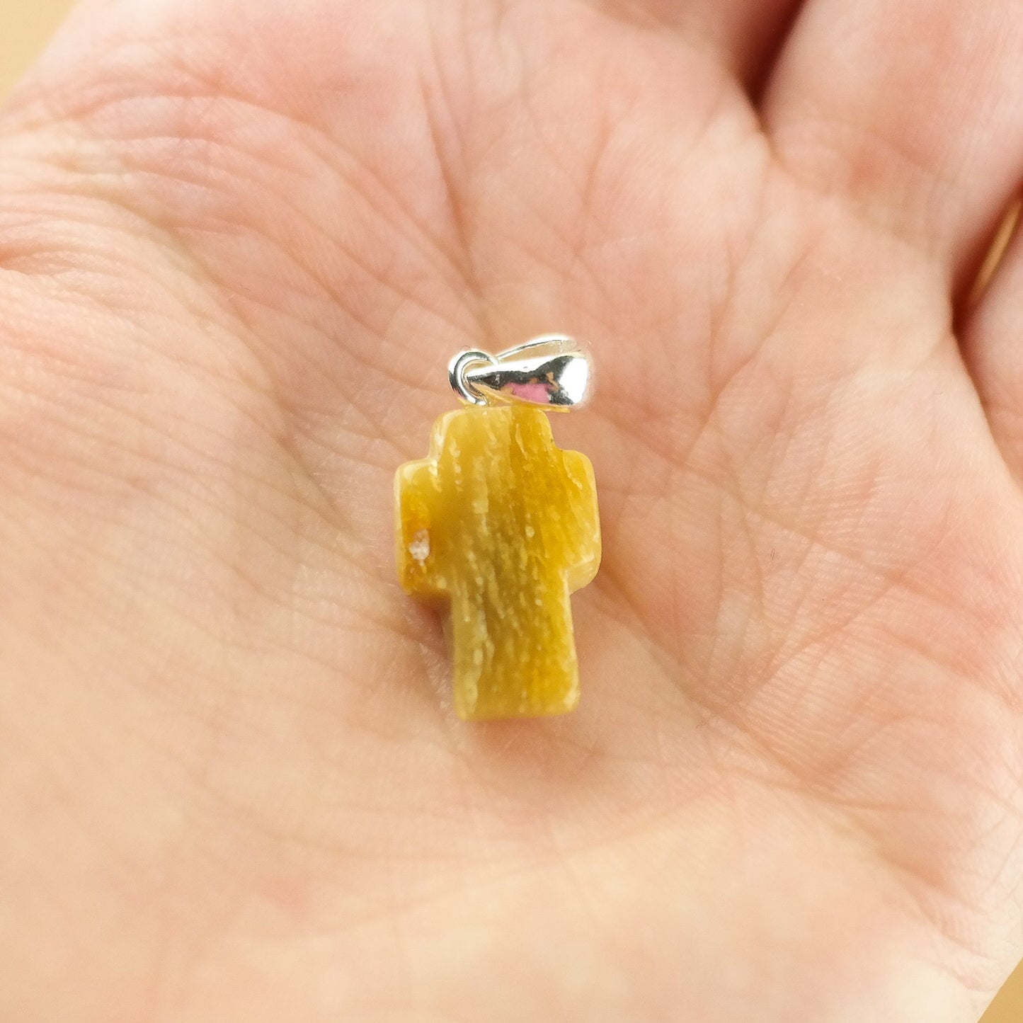 Amber cross pendant