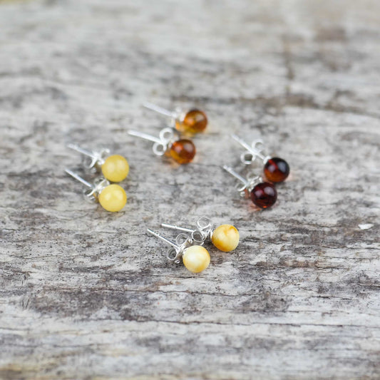 Stud earrings from natural Baltic amber beads