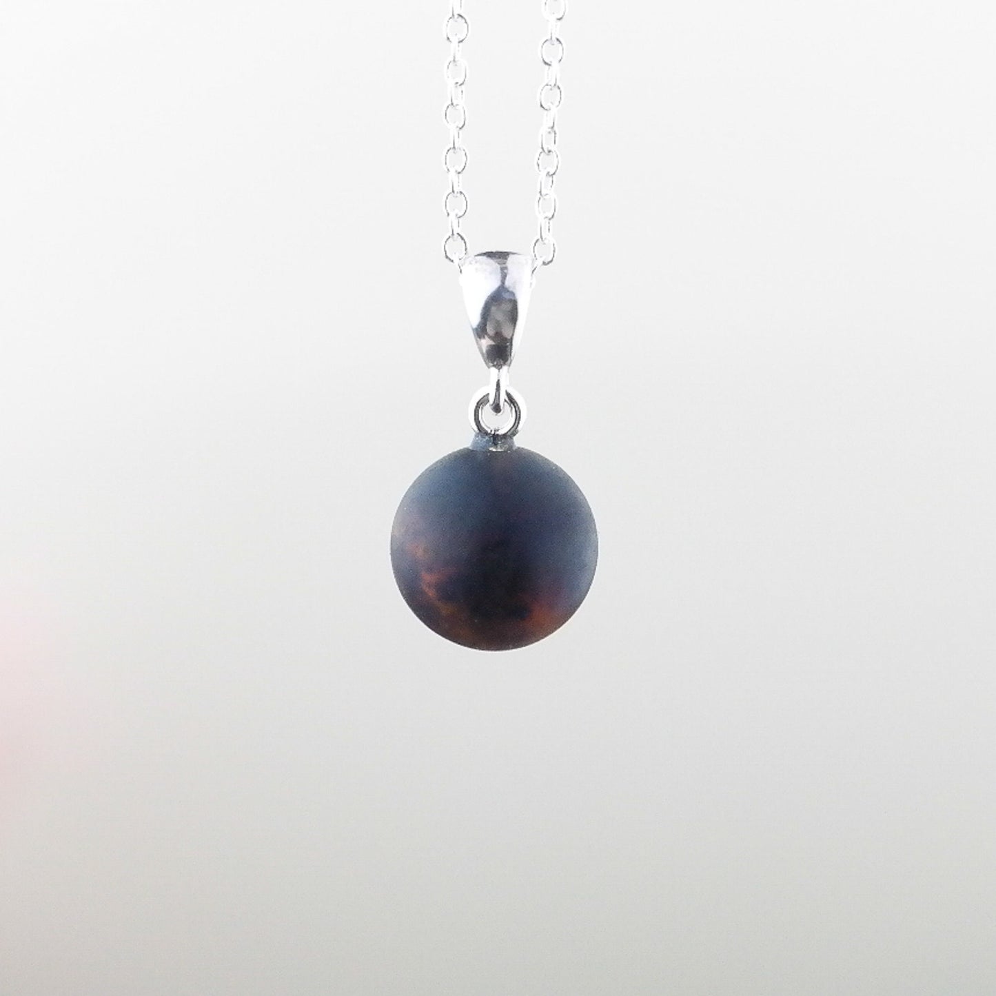 Round modern amber pendant